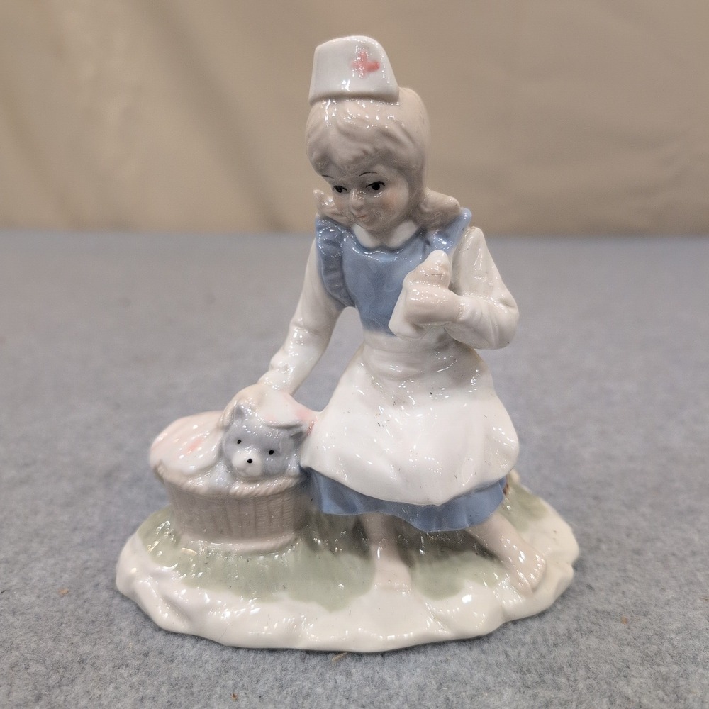 Vintage Porcelain Girl Nurse Figurine with Puppy in Basket Blue and White - Picture 1 of 7